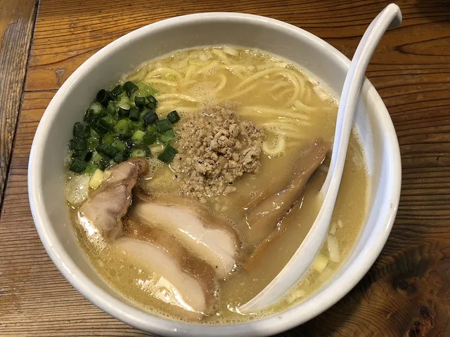 Chicken paitan at Tori no Ana, Ikebukuro. An actual chicken-paitan ramen bowl photographed at Tori no Ana in Ikebukuro in March 2018; a separate image from the tori-paitan style chapter.